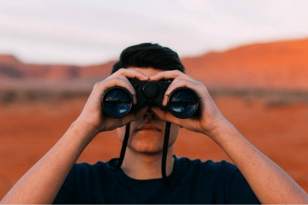 Leader Using Binoculars