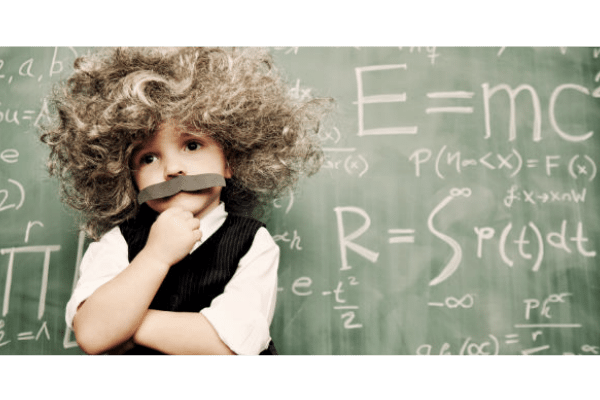 Small boy dressed as scientist Einstein